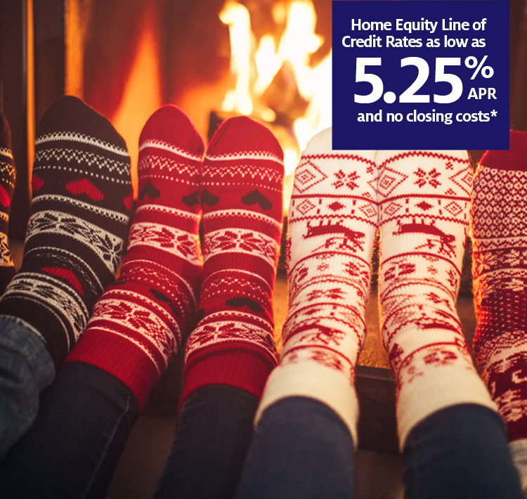 Feet warming by the fire with Home Equity Line of Credit call out.